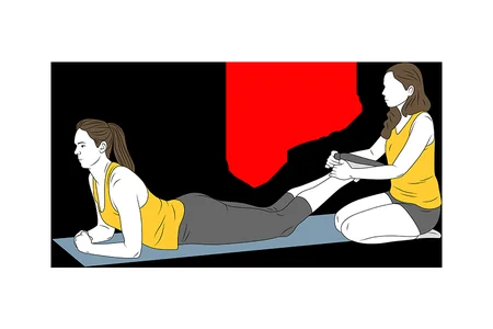 Curl femoral boca abajo con resistencia de compañero