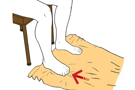 Arrugar una toalla con los dedos del pie